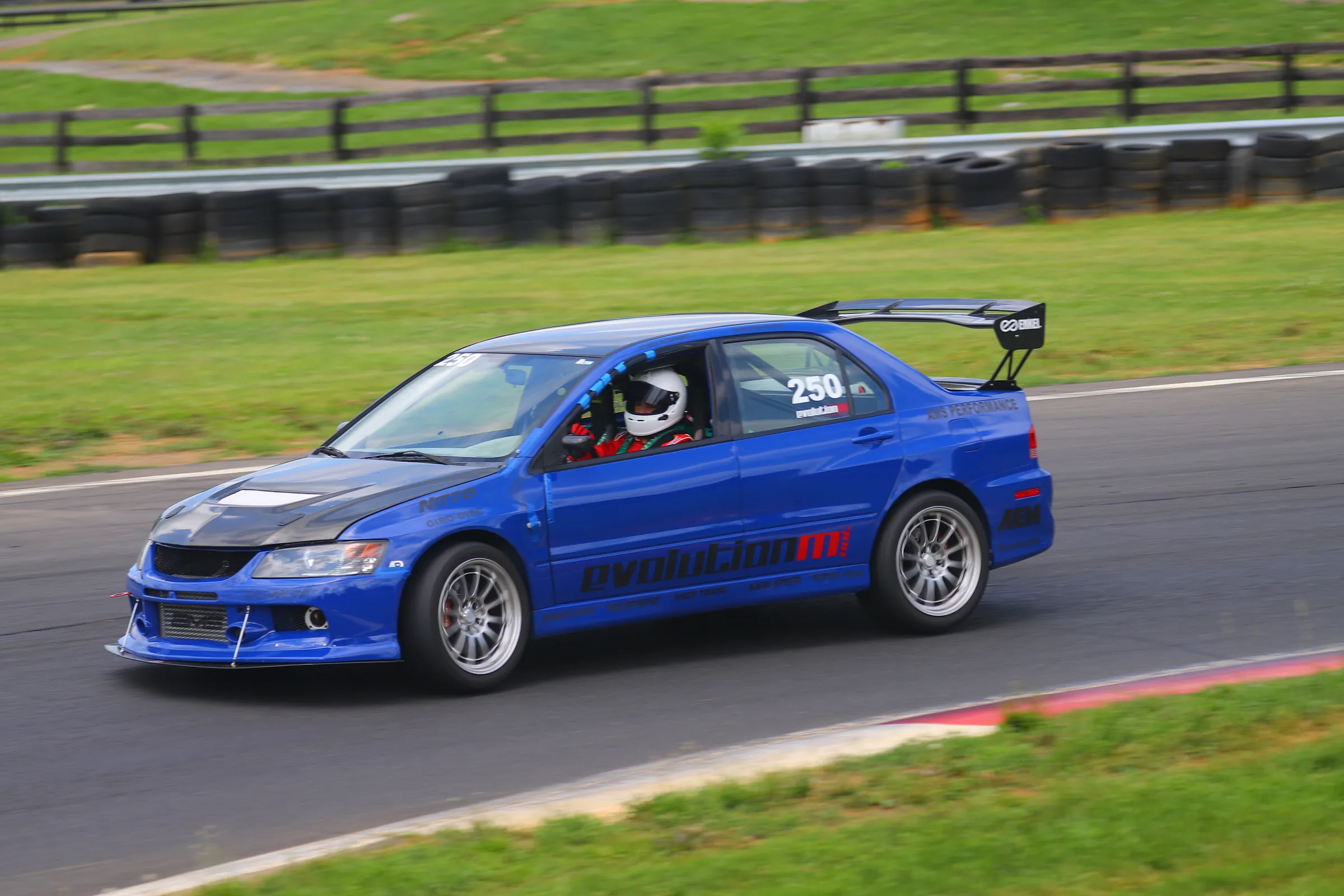 The blue Drive Theory Evo 8.5, number 250, on track at Summit Point